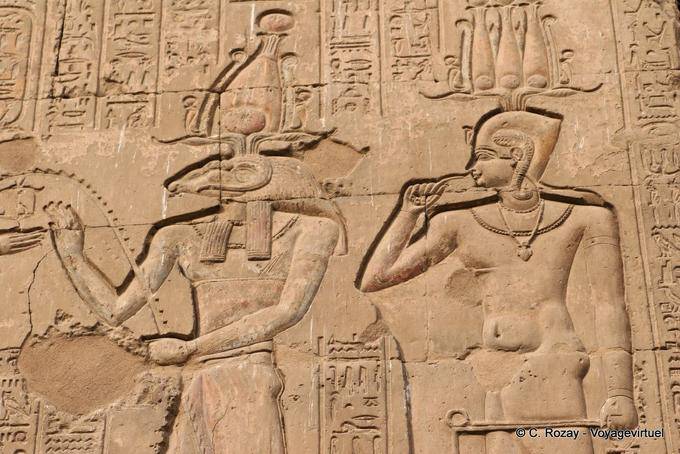 Relief of the facade, Khnum Osiris and another god, Esna Temple - Egypt