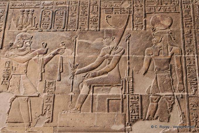 Offering cloths Neith by the king, relief, Esna Temple - Egypt
