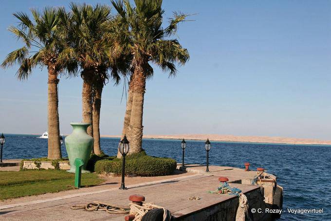 On the pier, palm trees and large vase, Hurghada - Egypt