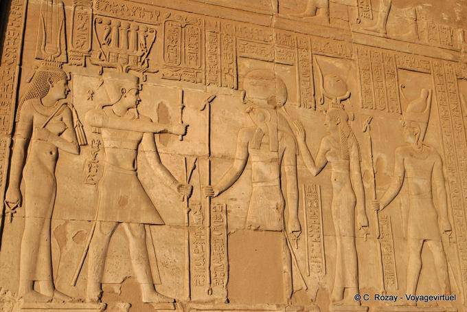 Frieze with Ptolemy VIII Hemhem crown wearing a crown and his wife Cleopatra. They give thanks to the divine triad Kom Ombo - Egypt
