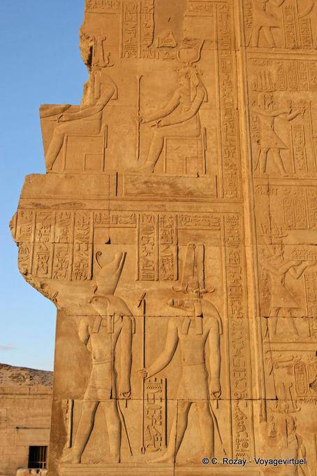 Fragment of bas-relief on a broken wall, figures of Horus and Sobek Temple of Kom Ombo - Egypt