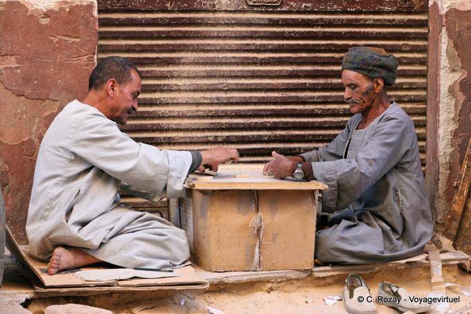 Domino players on cardboard on a street, Luxor - Egypt