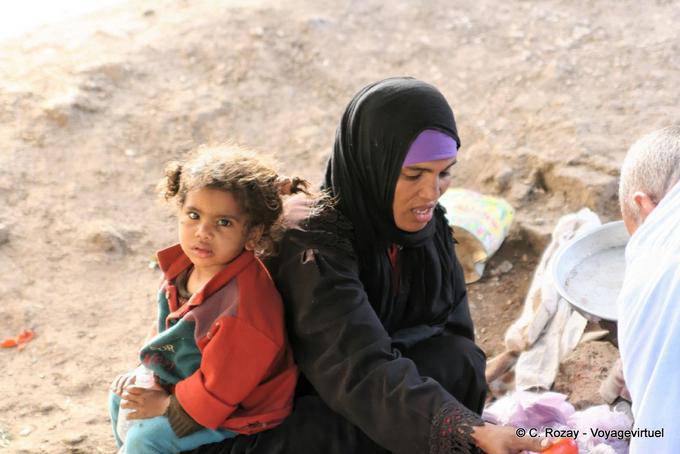 The mother and child with duvets Street Luxor - Egypt