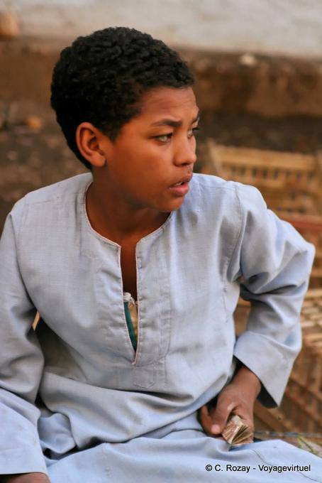 Portrait of worried little merchant, Luxor - Egypt