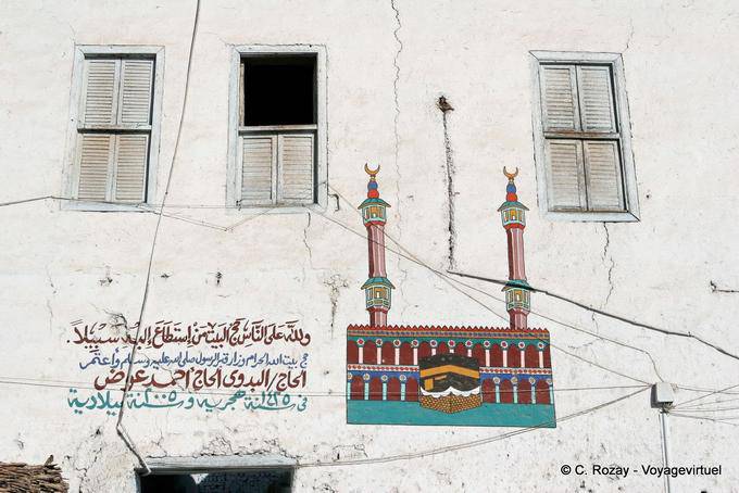 Mural painting and shutters on the facade of a house, Qurna - Egypt