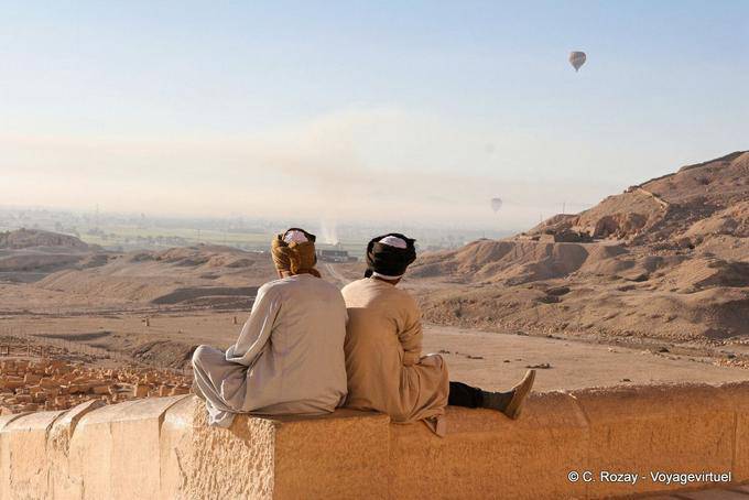 Meditation before the landscape and the remains of the temple of Mentuhotep II, Deir el-Bahari - Egypt