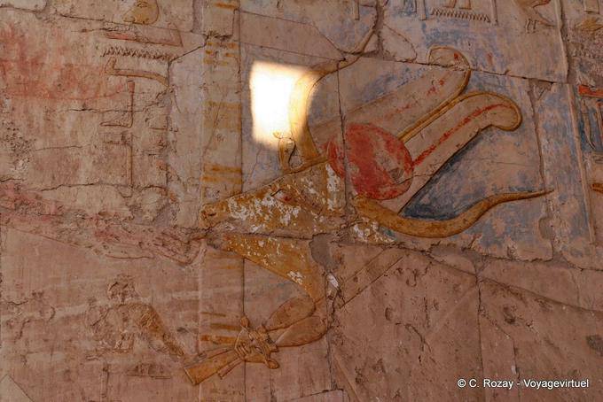 Hathor head cow licking a royal hand, Hatshepsut Temple - Egypt