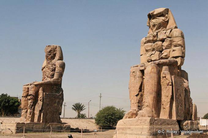 The colossal statues of Memnon mark the location of the Amenophium - Egypt