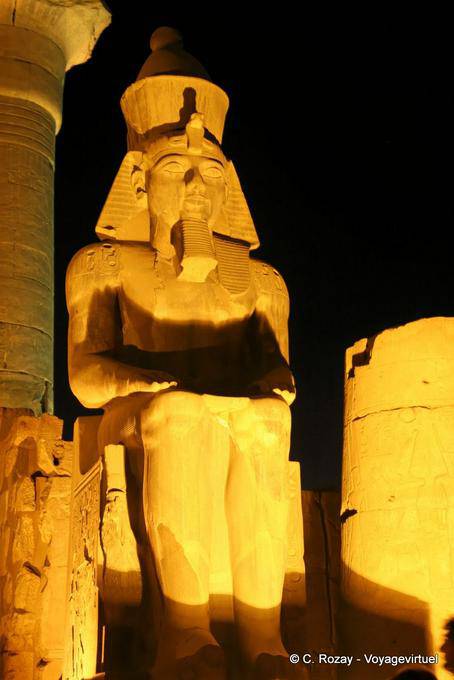 Colossal statue of Ramses II seated on a throne, Luxor - Egypt