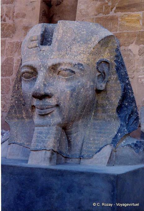 Ramses II head to the ground in front of the first pylon, Temple of Luxor - Egypt