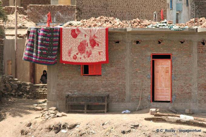 Carpets and brick house, Nil - Egypt