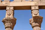 Pillars supporting capitals depicting the Goddess Hathor, Temple of Philae, Egypt.