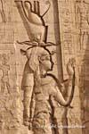 Sculpture of the goddess Hathor, wife of Horus, the right of the access door to the temple, Edfu, Egypt.