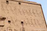 View on the right upper part of the outside of the tower, temple of Edfu, Egypt.