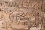 Offering cloths Neith by the king, relief, Esna Temple, Egypt.