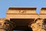 Winged sun disk on the ledge of the hall, the temple of Kom Ombo, Egypt.