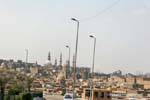 Street lights, domes and minarets of Cairo neighborhood, Egypt.