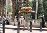 Bread holder on the head, Cairo, Egypt.