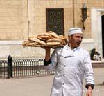 The baker and the typical flat bread, Cairo, Egypt.