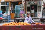 The small market of oranges in front of a butcher, Luxor, Egypt.