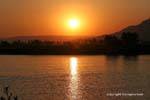 Sunset on the Nile opposite the Valley of the Kings, Luxor, Egypt.
