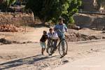 Three children with a bike, Luxor, Egypt.