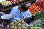 Reading the newspaper market in Luxor, Egypt.