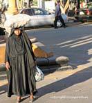 Victuals bag on head, Luxor, Egypt.