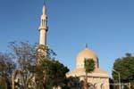 Mosque, minaret and dome, near the Nile Corniche, Luxor, Egypt.