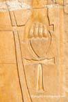 Hand holding the cross of life (or ankh ankh or cross), relief, temple of Hatshepsut, Egypt.