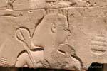 King holding the stick or cross heka with the flagellum, Karnak, Egypt.