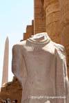 Headless statue wearing a necklace, Karnak Temple, Egypt.