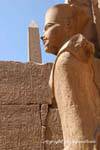 Crossing perspectives, Amon, hieroglyphs and top of obelisk, Karnak Temple, Egypt.