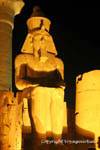 Colossal statue of Ramses II seated on a throne, Luxor, Egypt.