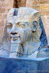 Ramses II head to the ground in front of the first pylon, Temple of Luxor, Egypt.