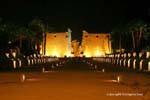 Night panorama of the dromos and the pylon of Ramses II, Luxor, Egypt.