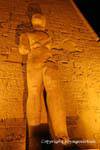 Shadow of the stone colossus, Luxor Temple, Egypt.