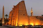 Profile of the first pylon, illuminated minaret obelisk, Luxor, Egypt.