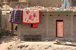 Carpets and brick house, Nil, Egypt.