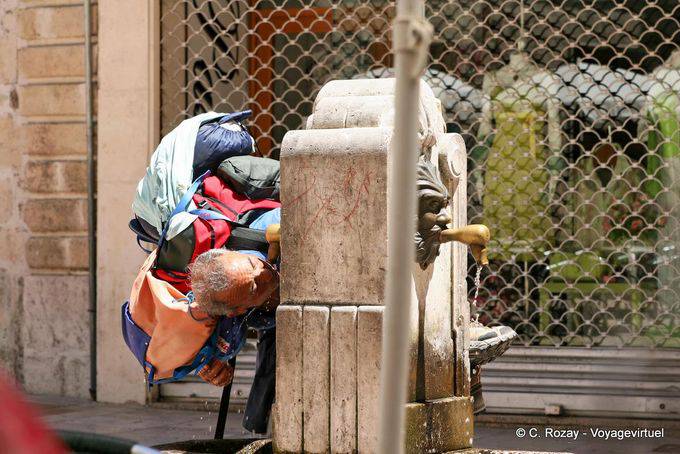 Compostela pilgrim drinking from a fountain Burgos - Spain