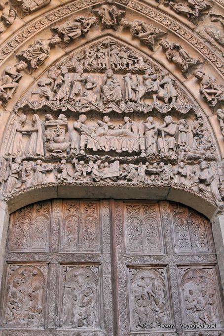 Tympanum of the San Juan Door representing the cycle of the Nativity of Jesus, Visitation, Nativity, Adoration of the Shepherds, Herod, Epiphany and Massacre of the Innocents, León Cathedral - Spain