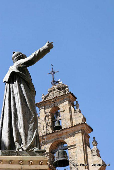 Catholic statue in front of the belfry storks, Salamanca - Spain