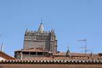 Above the rooftops, bell tower of the Cathedral del Salvador, Ávila, Spain.