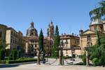 Statues face to face, Anaya plaza, overlooking Iglesia de la Clerecía Salamanca, Spain.