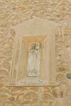 Religious niche in a wall, Segovia, Spain.