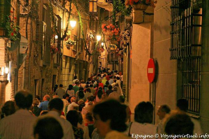 Crowd in the night street procession in Toledo - Spain