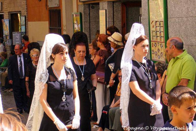 Devotees wearing white mantillas, procession in Toledo - Spain