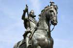 Bronze equestrian statue of Felipe III Plaza Mayor, pigeon curiosity, Madrid, Spain.