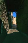 Dark wood vaulted passage, Calle Colegio Doncellas, Toledo, Spain.