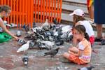Valencia, children and pigeons, Spain.